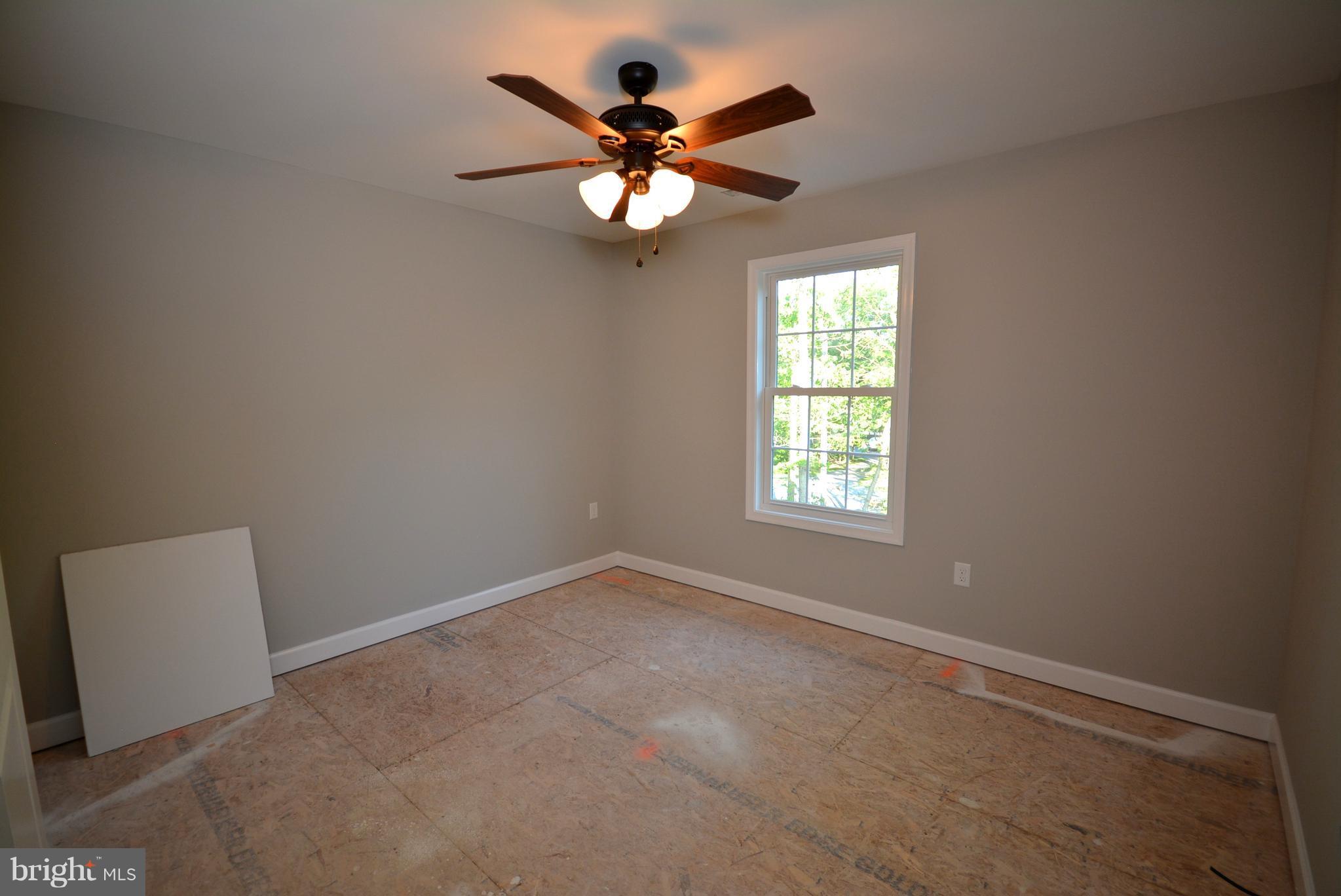 155 Lower View Road Strasburg, VA 22657 - Photo 23 of 30 an empty room with windows and fan