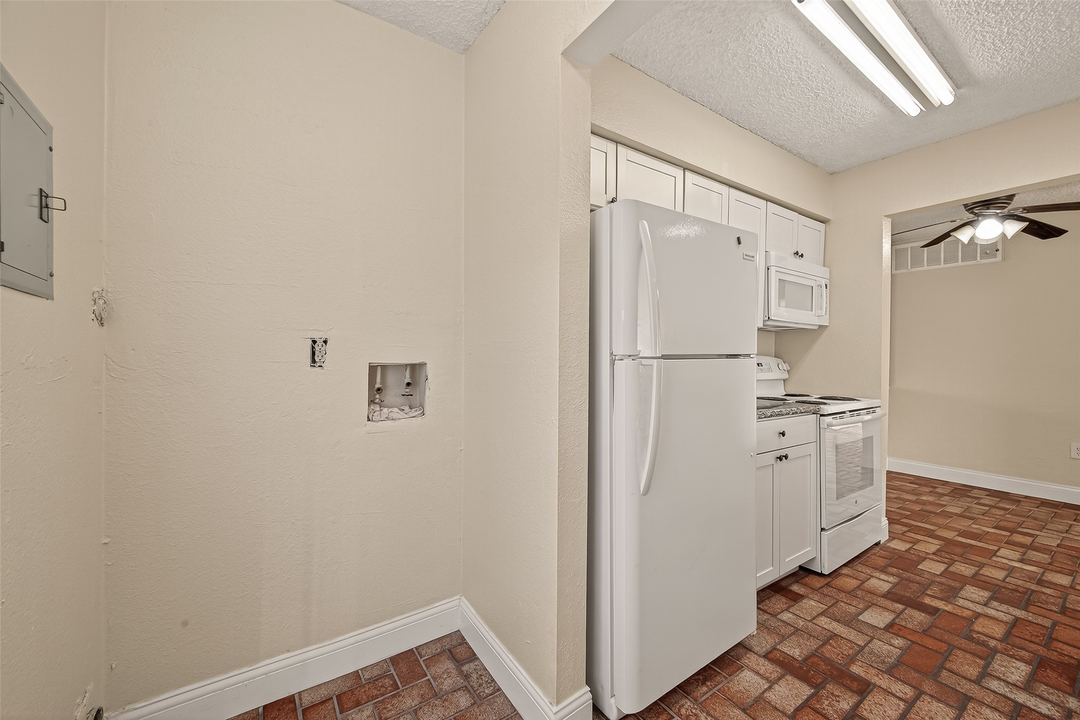 1500 Bay Area Boulevard, Unit 183 Houston, TX 77058 - Photo 11 of 24 a view of a refrigerator in kitchen and a sink