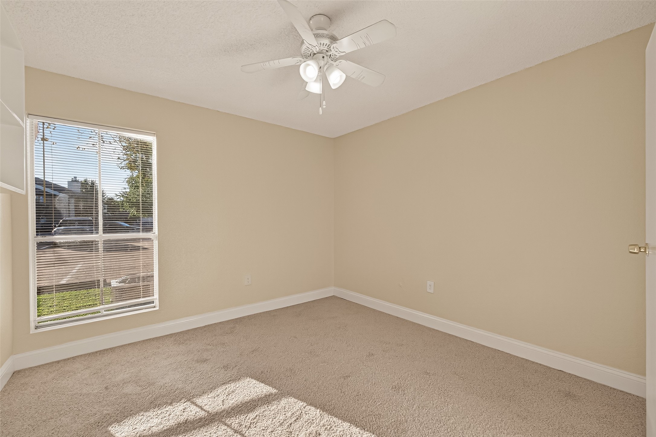 1500 Bay Area Boulevard, Unit 183 Houston, TX 77058 - Photo 13 of 24 an empty room with a window and a fan