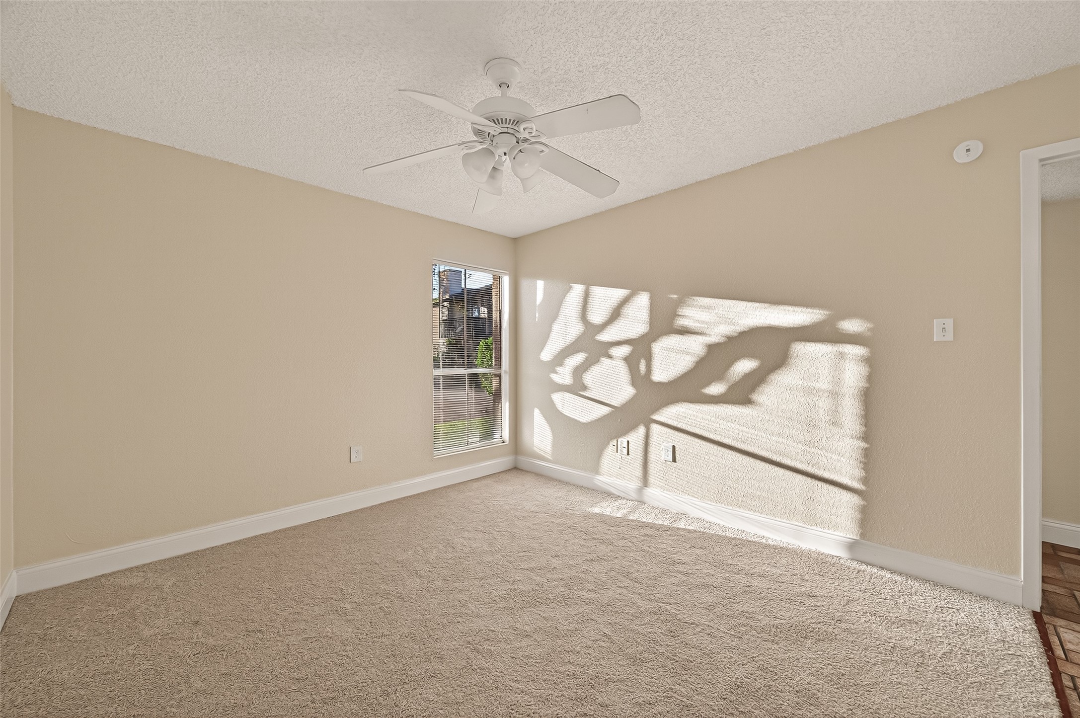 1500 Bay Area Boulevard, Unit 183 Houston, TX 77058 - Photo 19 of 24 an empty room with windows and fan