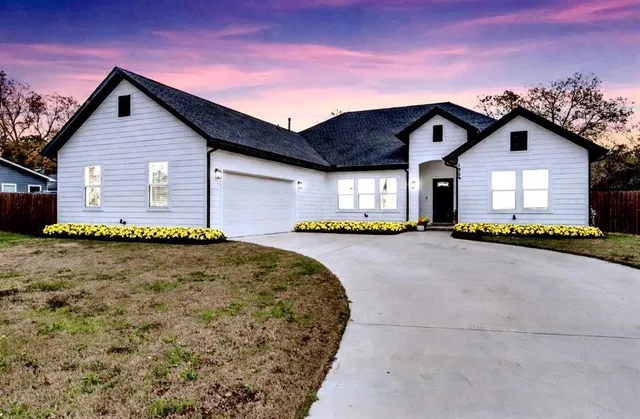 a front view of a house with yard