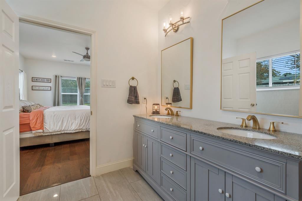 1909 Willowcrest Loop Denton, TX 76205 - Photo 20 of 40 Ensuite bathroom with double vanity, ceiling fan, and light wood finished floors
