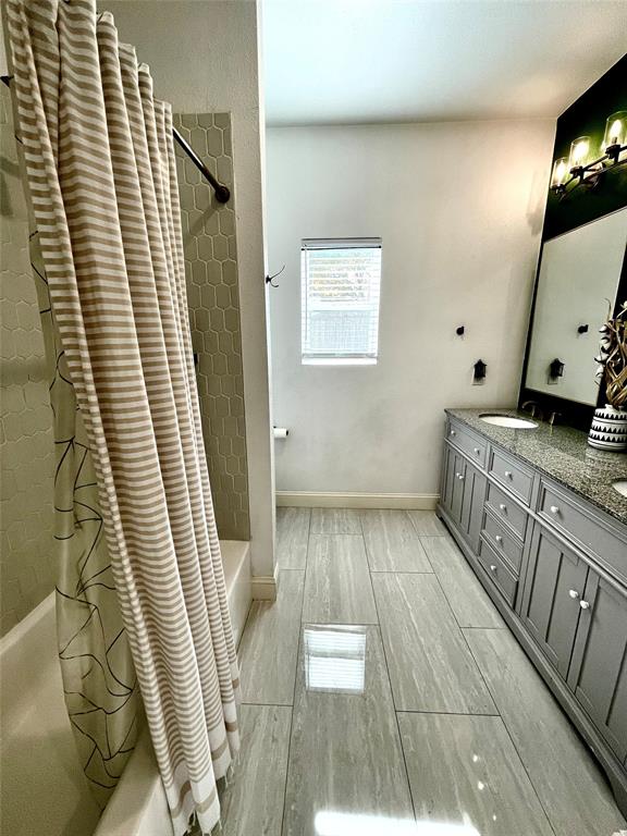 1909 Willowcrest Loop Denton, TX 76205 - Photo 28 of 40 Full bathroom with shower / bathtub combination with curtain and double vanity