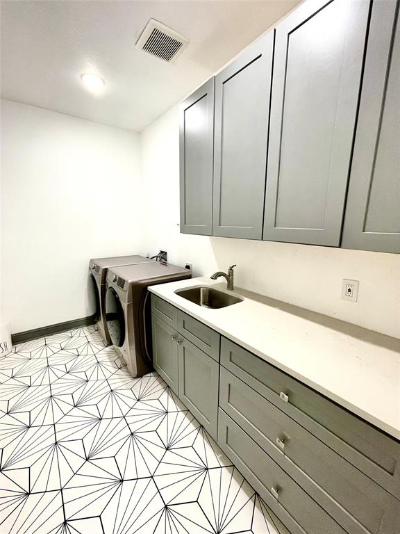 1909 Willowcrest Loop Denton, TX 76205 - Photo 30 of 40 Enormous Laundry room featuring a sink, decorative tile and lots of counter space and cabinet space