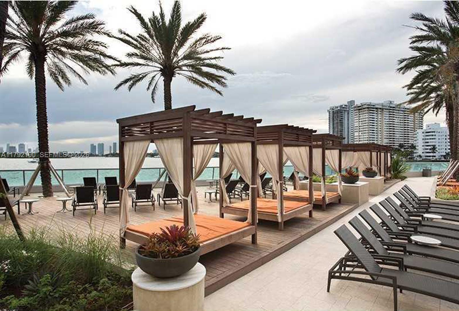 1500 Bay Road, Unit 1528S Miami Beach, FL 33139 - Photo 24 of 29 a view of a swimming pool with furniture