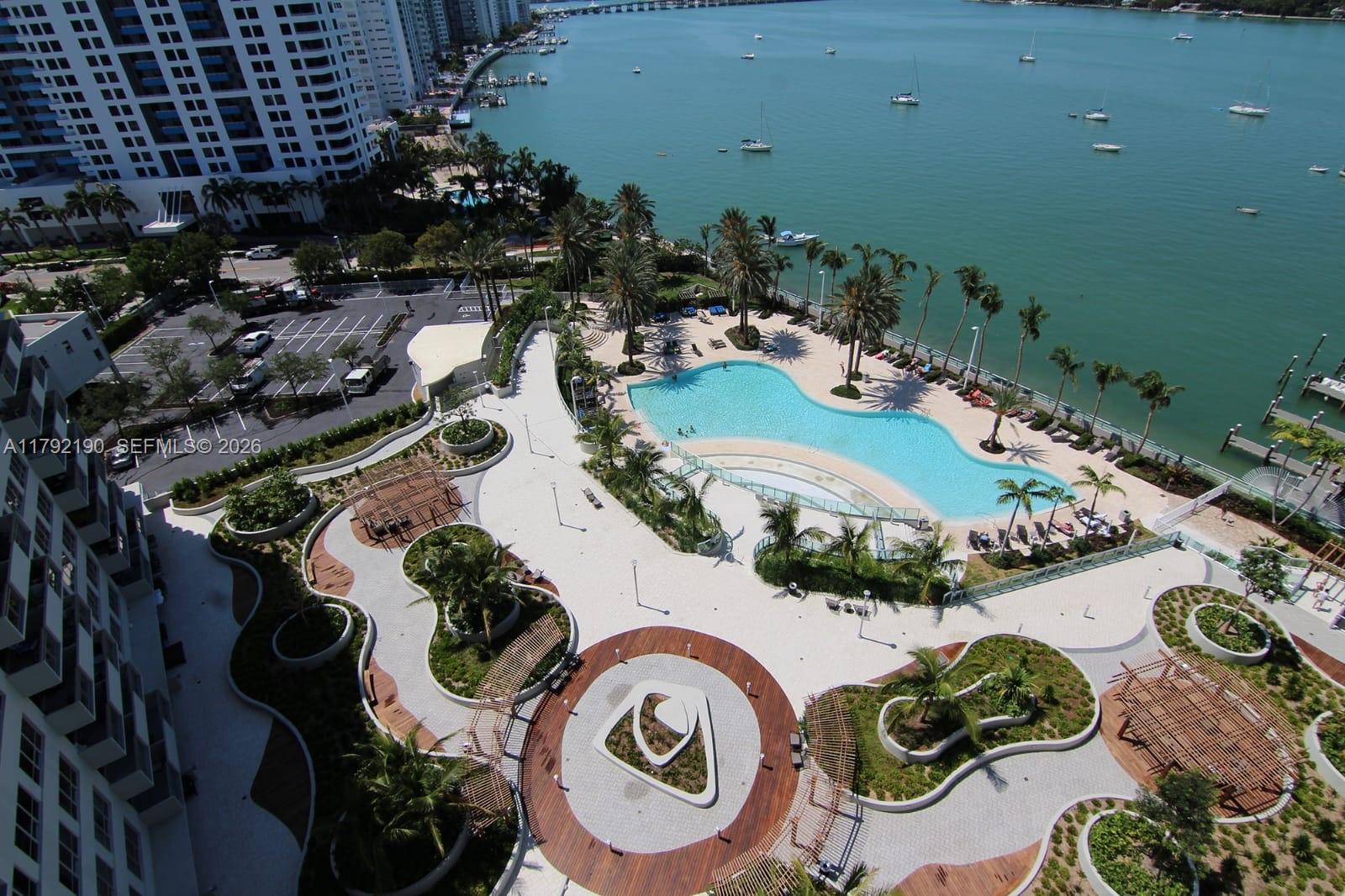1500 Bay Road, Unit 1528S Miami Beach, FL 33139 - Photo 4 of 29 an aerial view of a swimming pool with outdoor seating