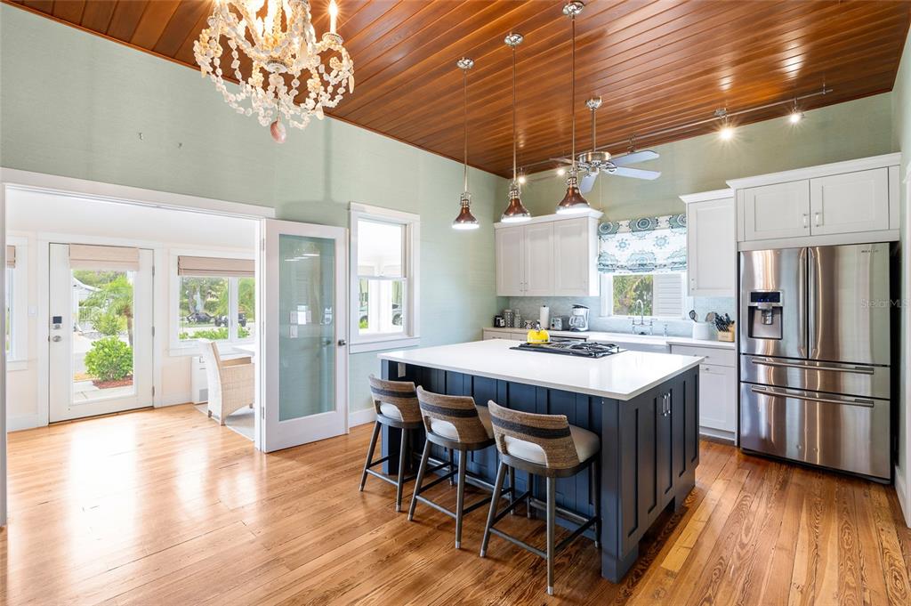 340 Palm Avenue Boca Grande, FL 33921 - Photo 12 of 38 a kitchen that has a table chairs and wooden floor