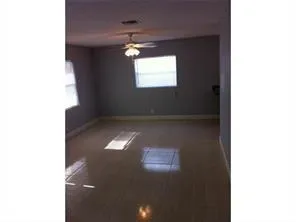 a view of an empty room with a window