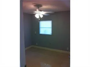 a view of a chandelier fan in a room