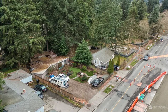 an aerial view of a house with a yard