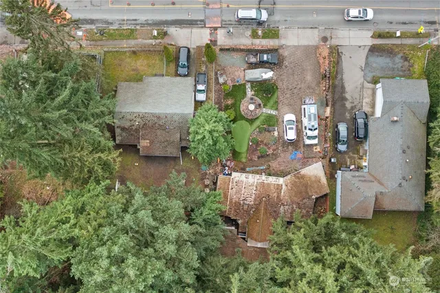 an aerial view of residential building with trees