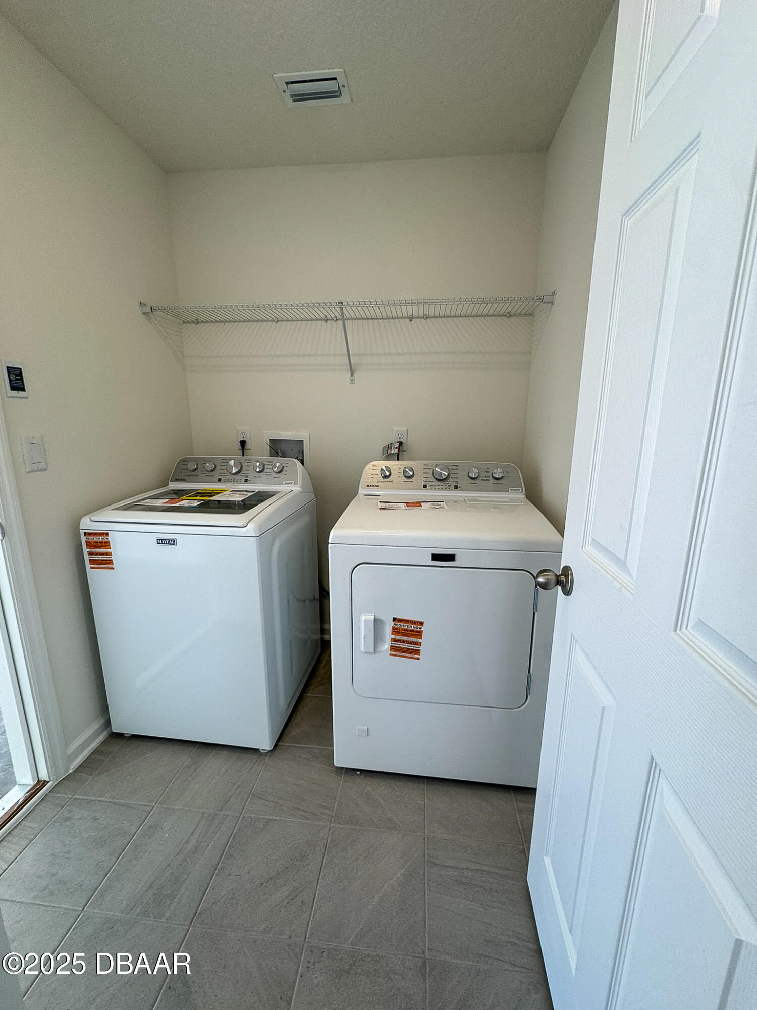 55 Signet Circle Flagler Beach, FL 32136 - Photo 8 of 32 a utility room with dryer and washer
