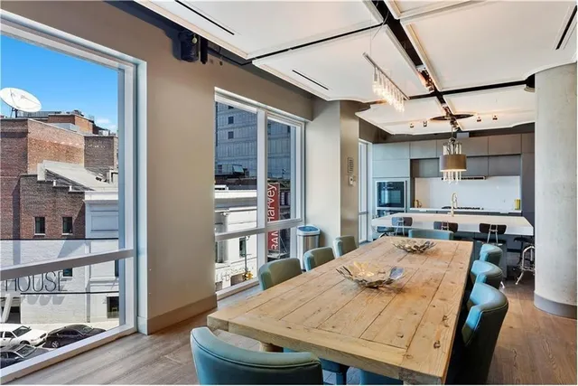 a outdoor dining space with furniture and kitchen view