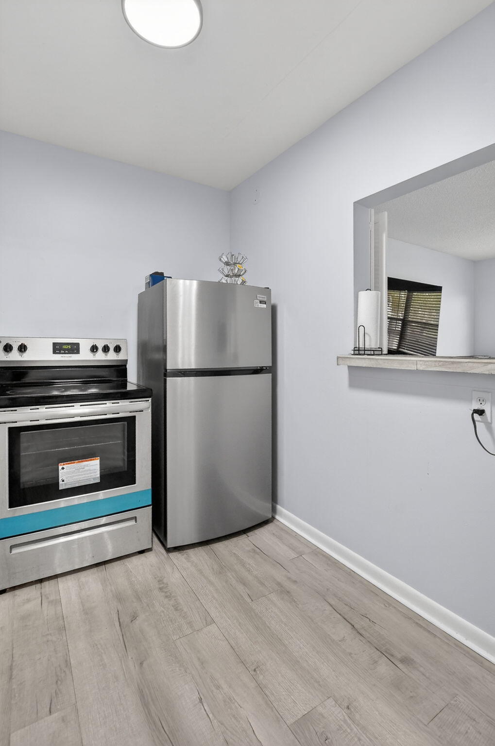 485 Mansfield K Boca Raton, FL 33434 - Photo 14 of 73 a kitchen with a refrigerator and a stove