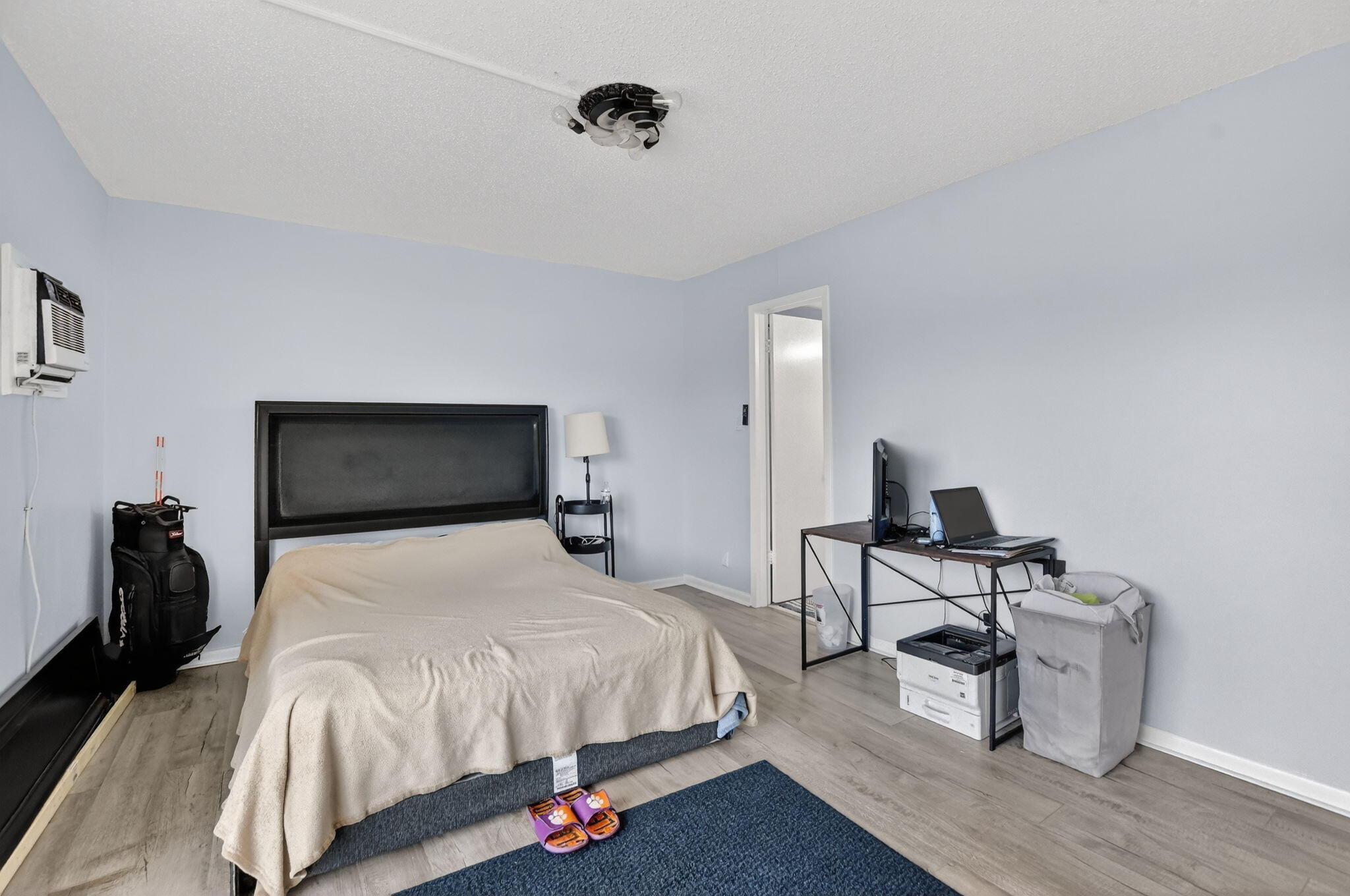 485 Mansfield K Boca Raton, FL 33434 - Photo 20 of 73 a bedroom with a bed and wooden floor