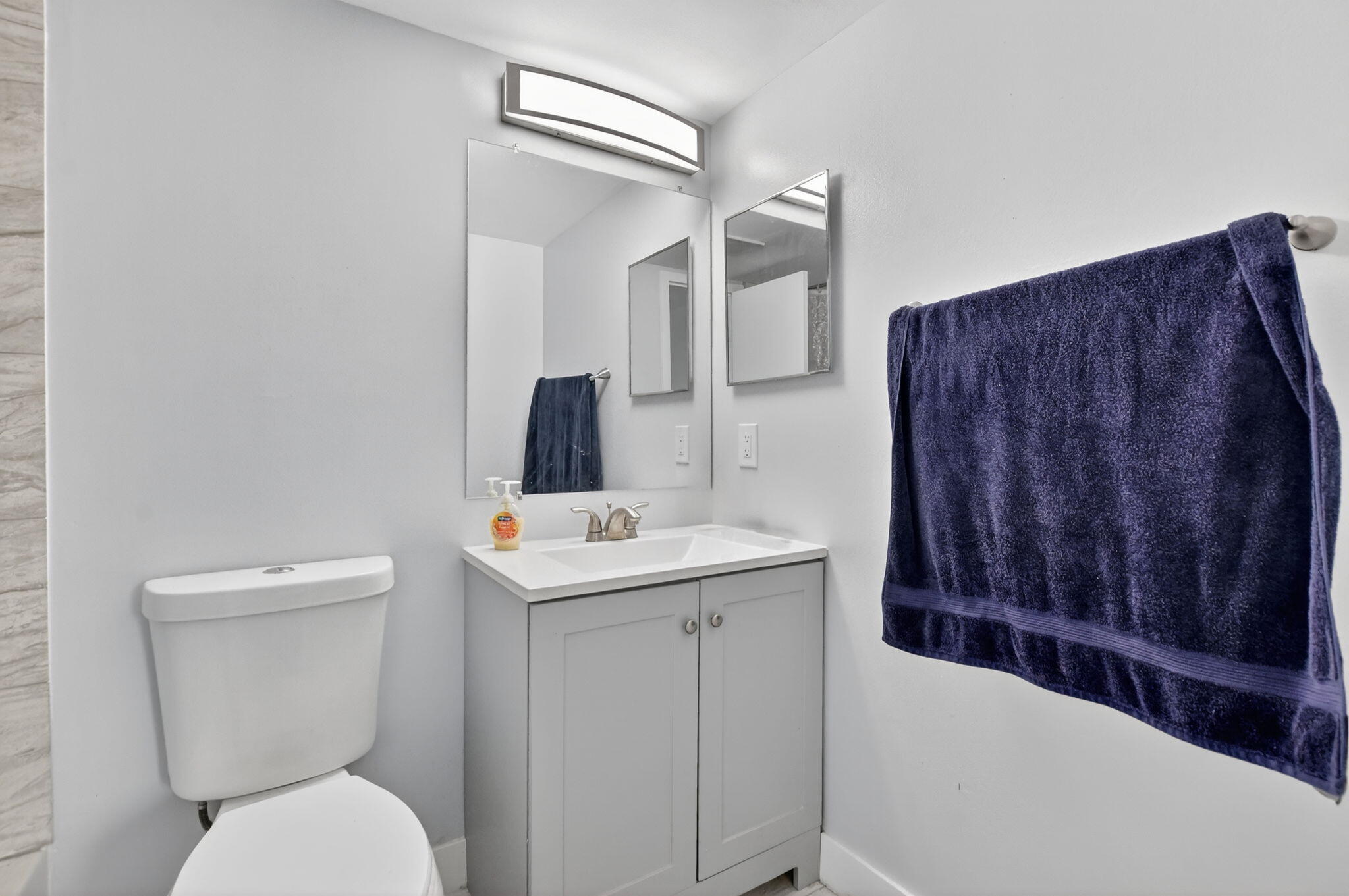 485 Mansfield K Boca Raton, FL 33434 - Photo 22 of 73 a bathroom with a toilet a sink and mirror