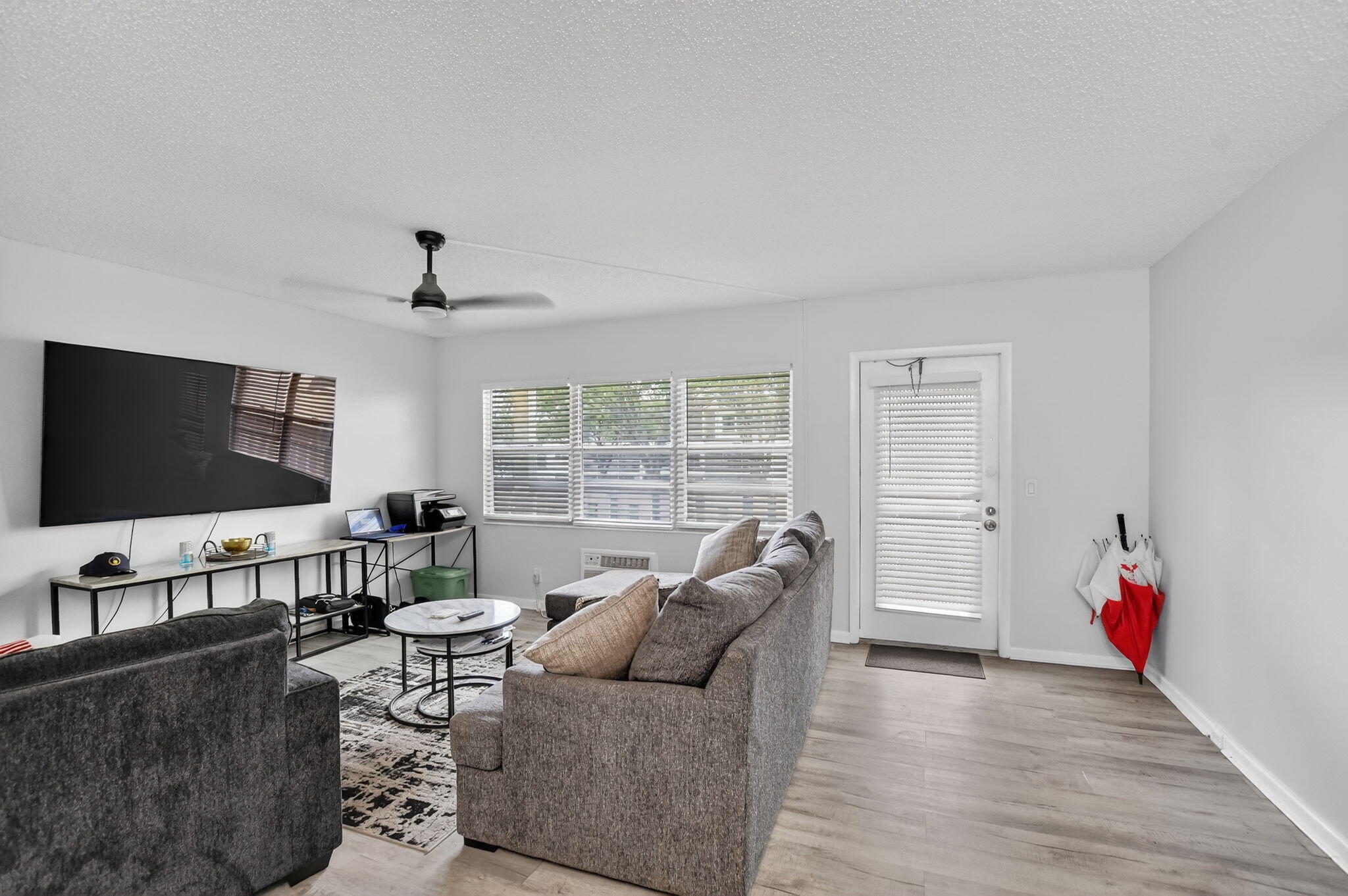 485 Mansfield K Boca Raton, FL 33434 - Photo 6 of 73 a living room with furniture and a flat screen tv
