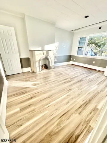 a view of living room with furniture and large window
