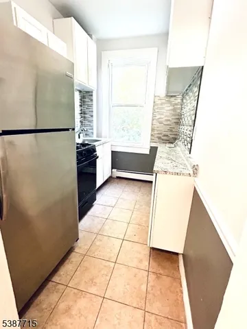a view of kitchen with furniture and large window