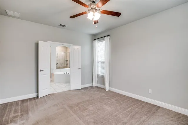 a view of a livingroom with a chandelier fan