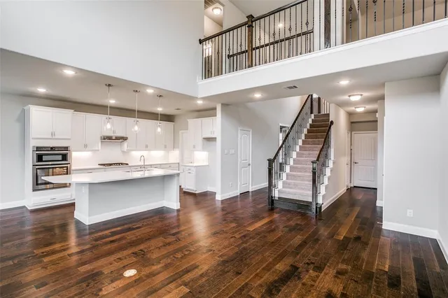 a view of kitchen with cabinets and wooden floor