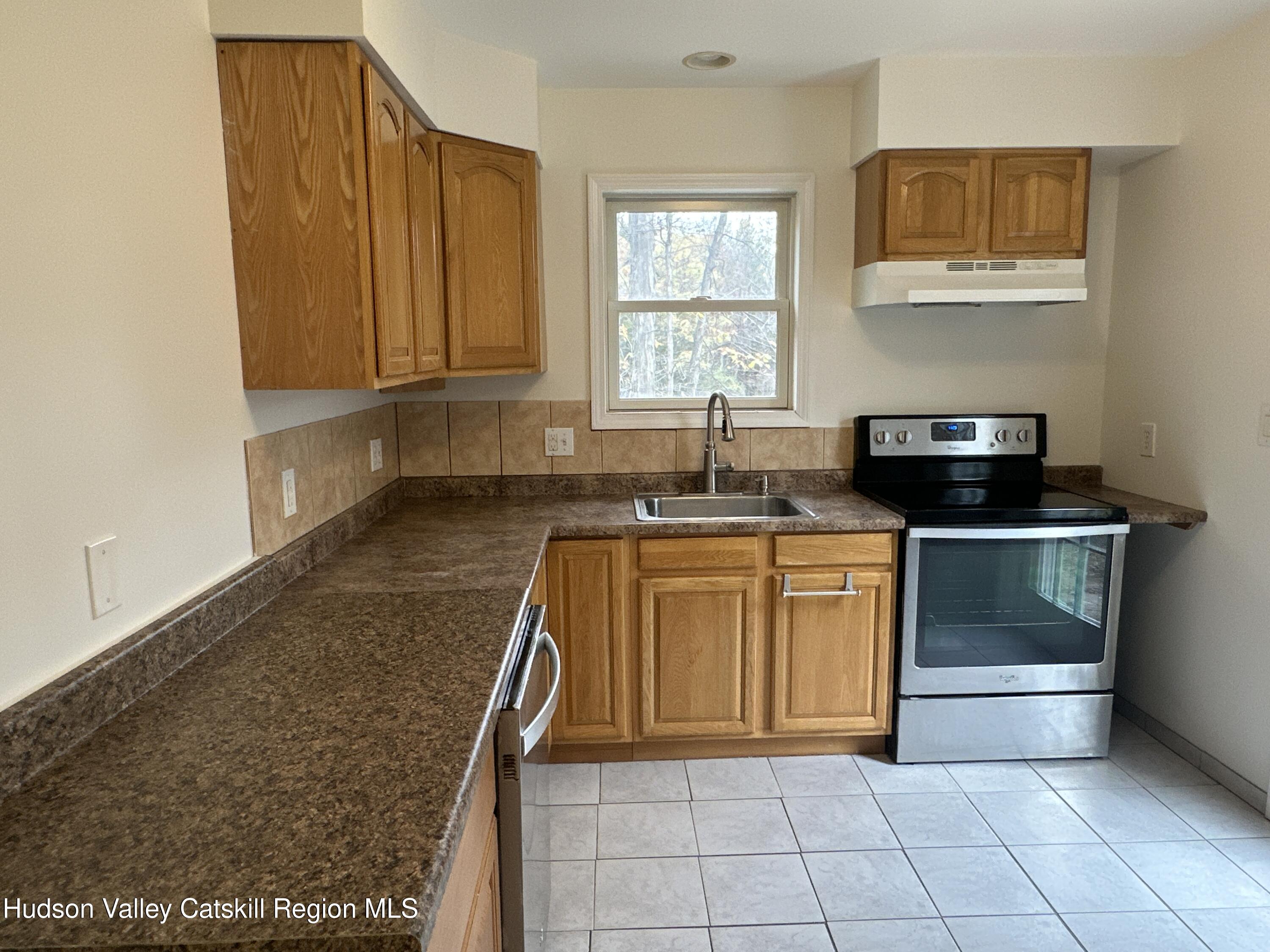 470 Edison Timmerman Road Cairo, NY 12413 - Photo 13 of 29 a kitchen with stainless steel appliances granite countertop a sink and a stove