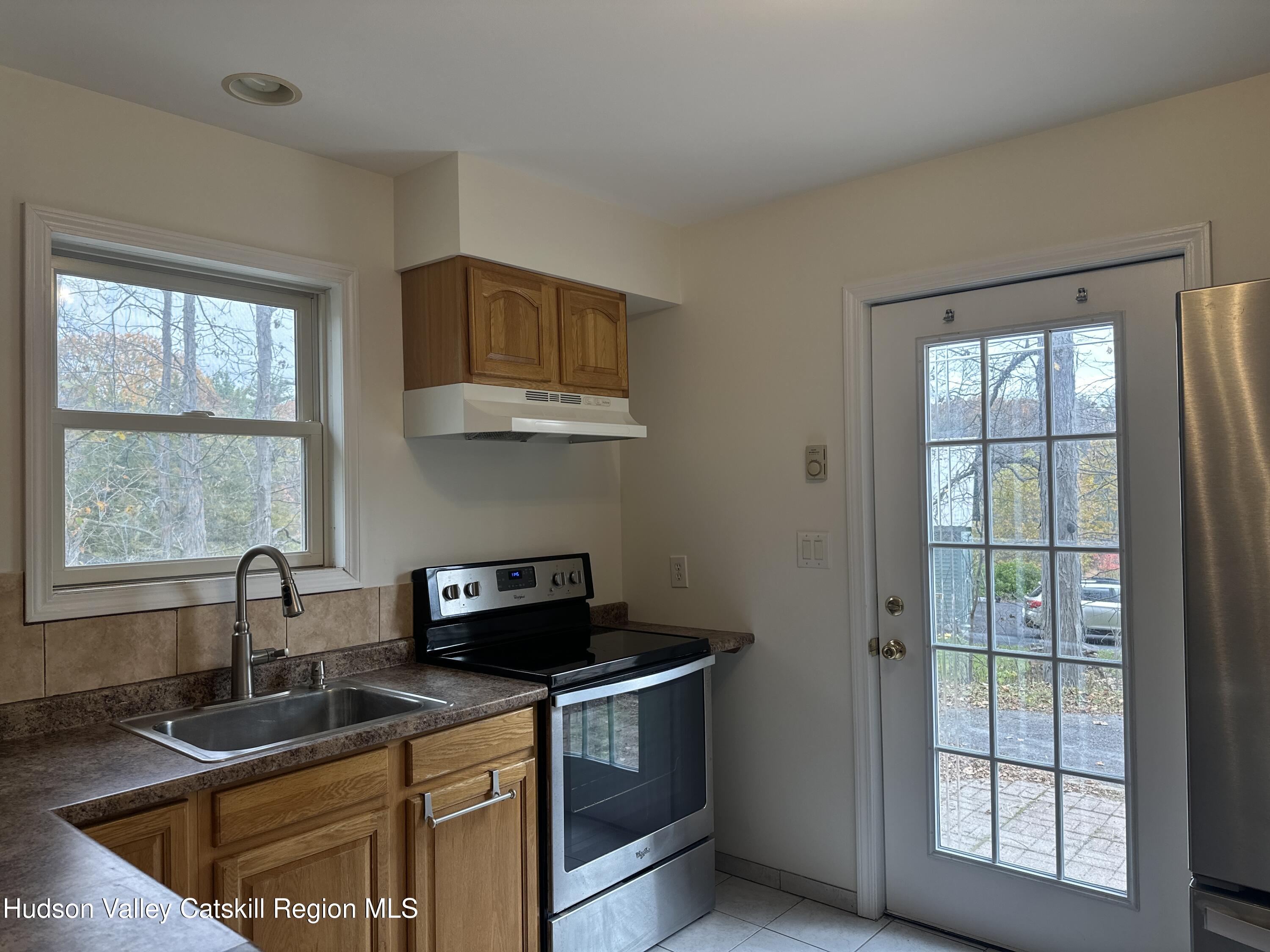 470 Edison Timmerman Road Cairo, NY 12413 - Photo 14 of 29 a kitchen with kitchen island a sink a stove and a window