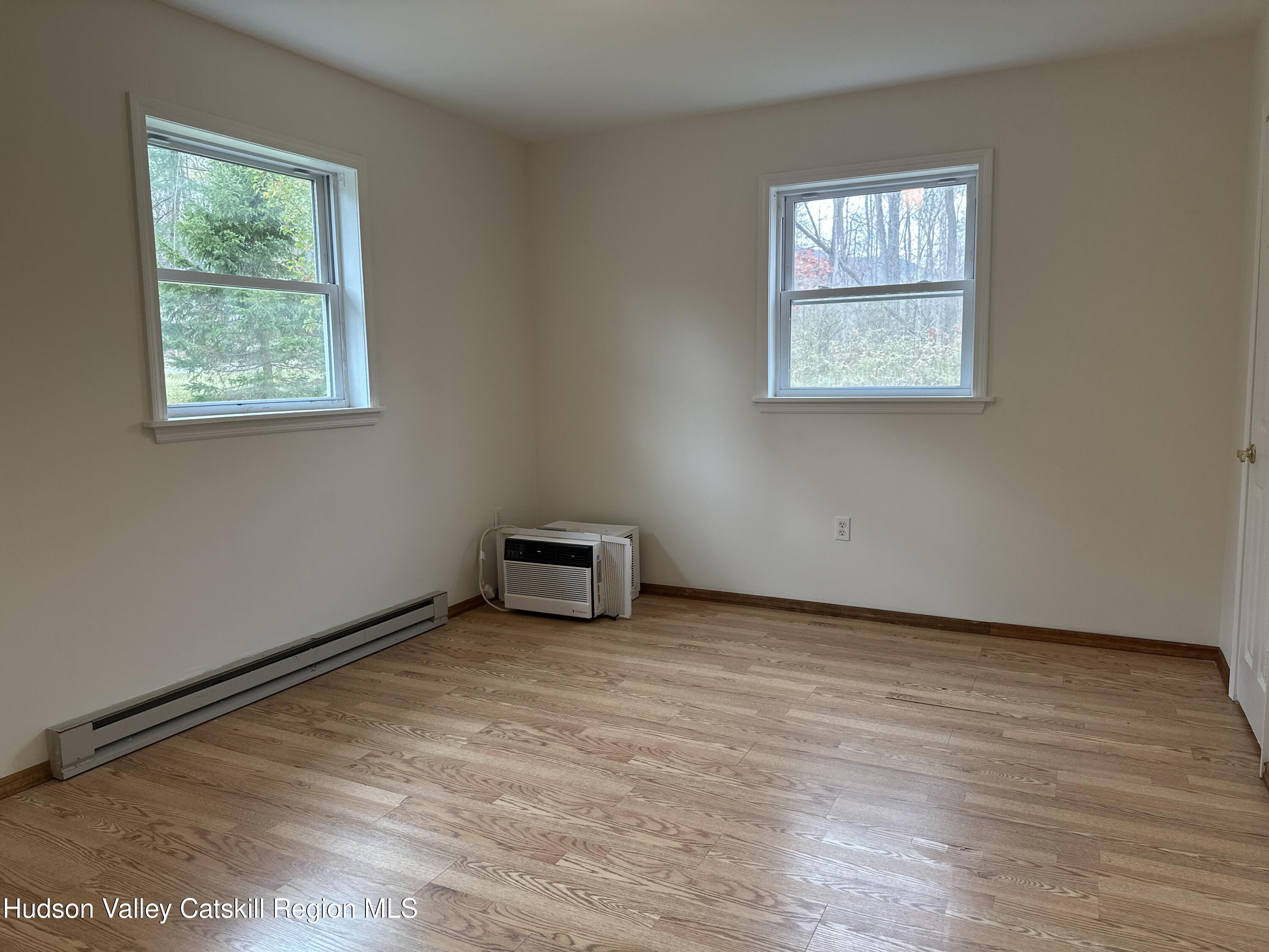 470 Edison Timmerman Road Cairo, NY 12413 - Photo 17 of 29 an empty room with windows