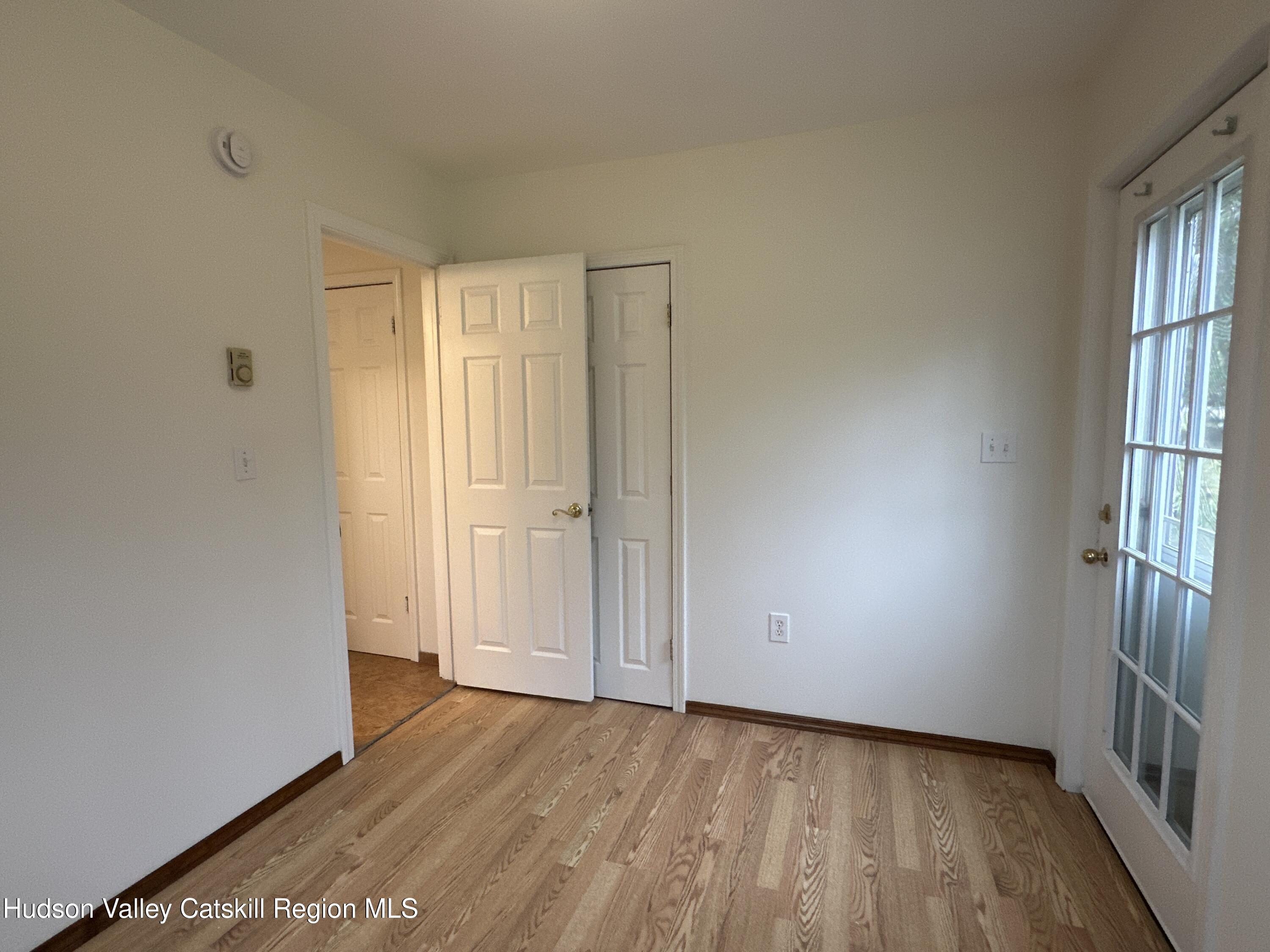 470 Edison Timmerman Road Cairo, NY 12413 - Photo 18 of 29 wooden floor in an empty room with a window