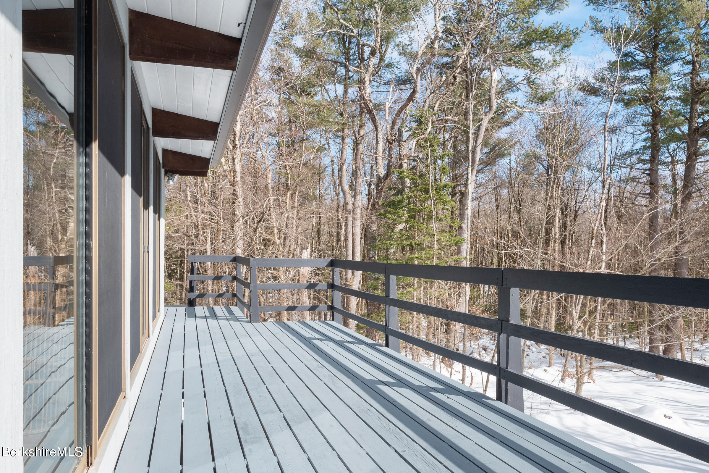 176 Beech Tree Lane Becket, MA 01223 - Photo 11 of 44 a view of balcony with wooden floor