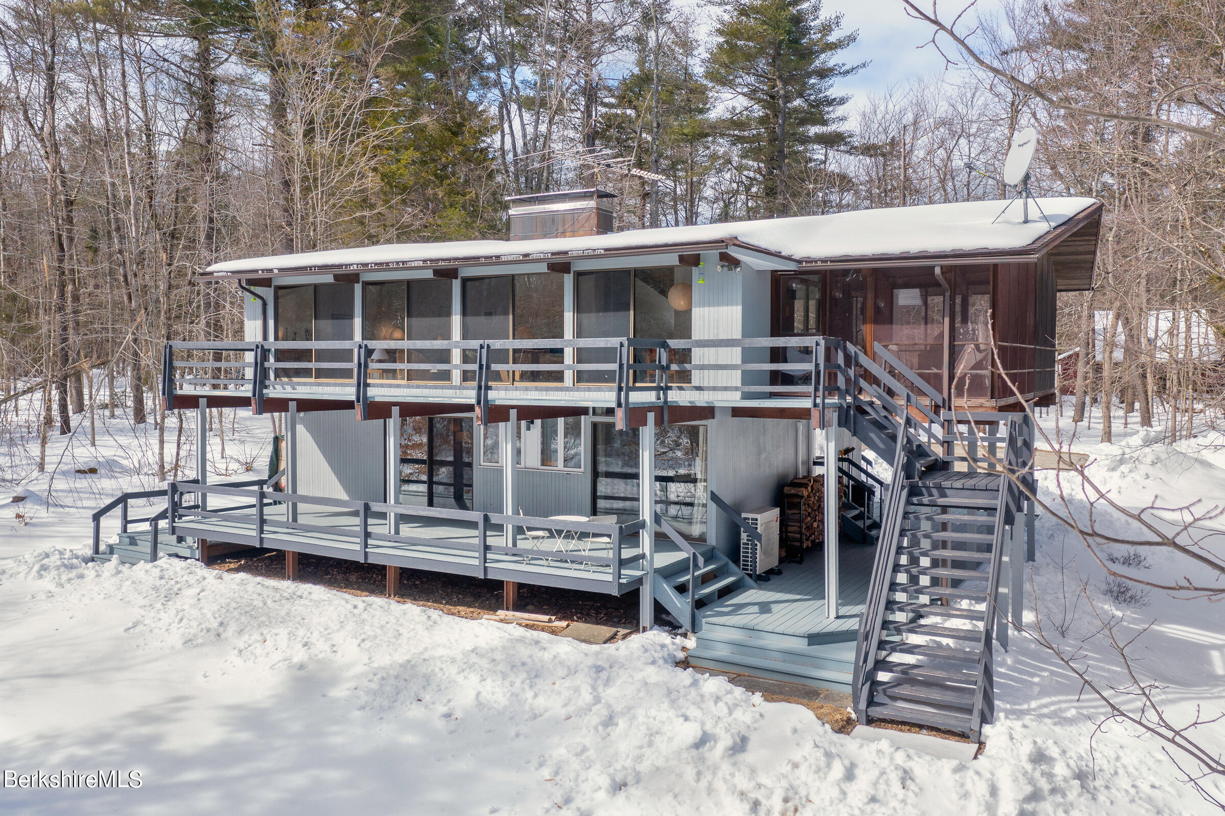176 Beech Tree Lane Becket, MA 01223 - Photo 12 of 44 a view of a house with a yard chairs and wooden fence