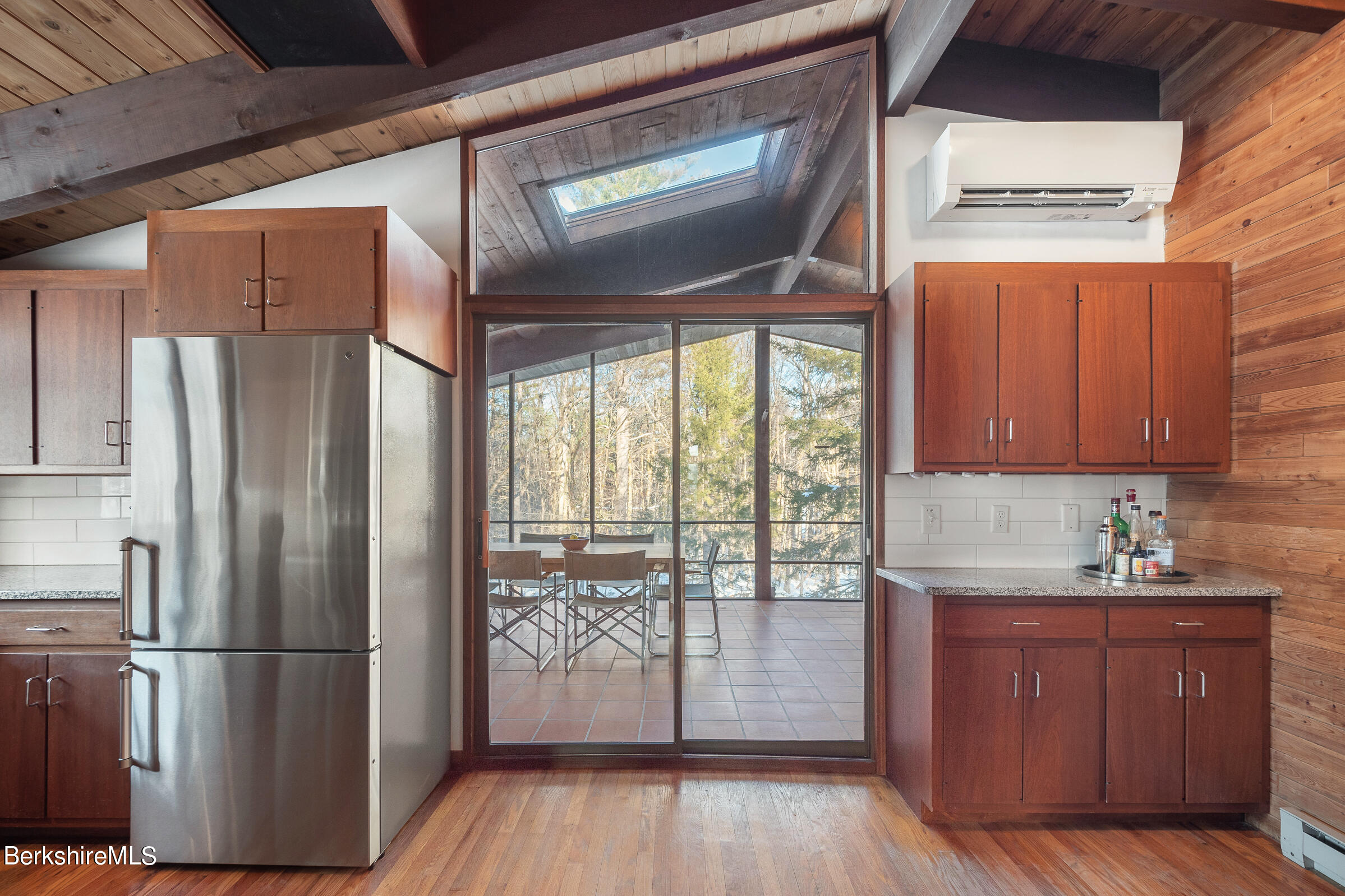 176 Beech Tree Lane Becket, MA 01223 - Photo 14 of 44 a kitchen with stainless steel appliances granite countertop a refrigerator a sink and wooden floors