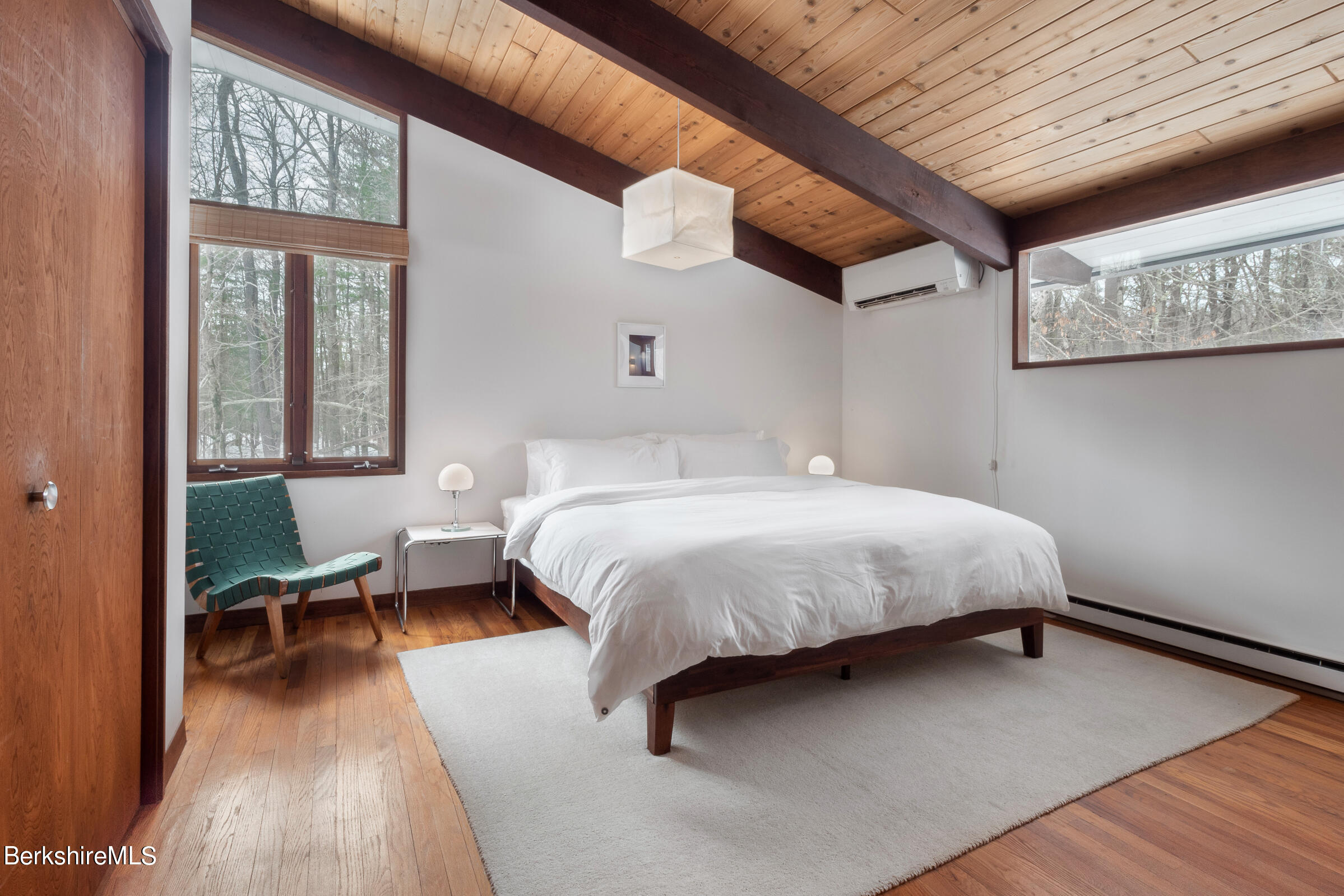 176 Beech Tree Lane Becket, MA 01223 - Photo 20 of 44 a bedroom with a bed and wooden floor