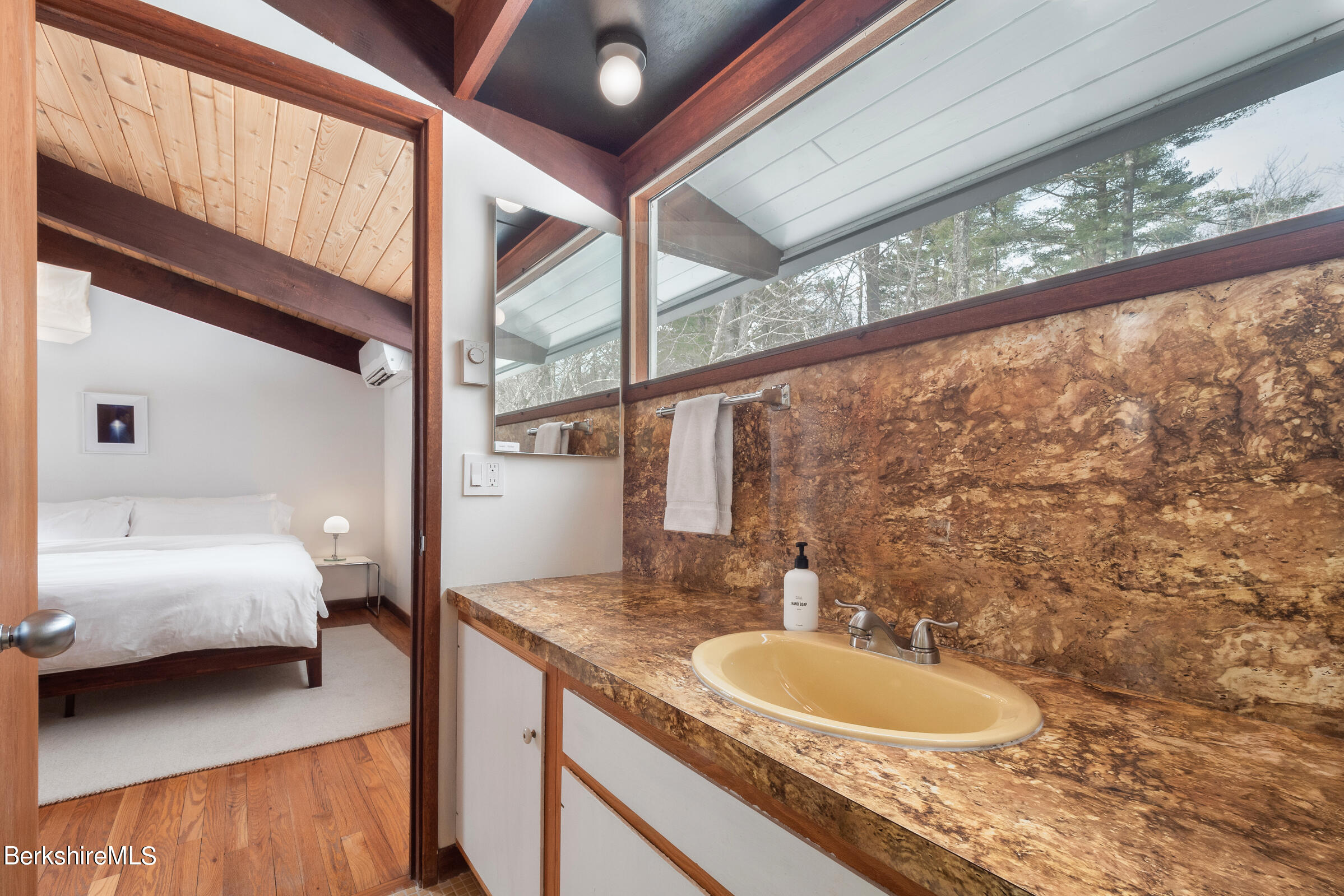 176 Beech Tree Lane Becket, MA 01223 - Photo 21 of 44 a en suite bathroom with a granite countertop sink and a mirror