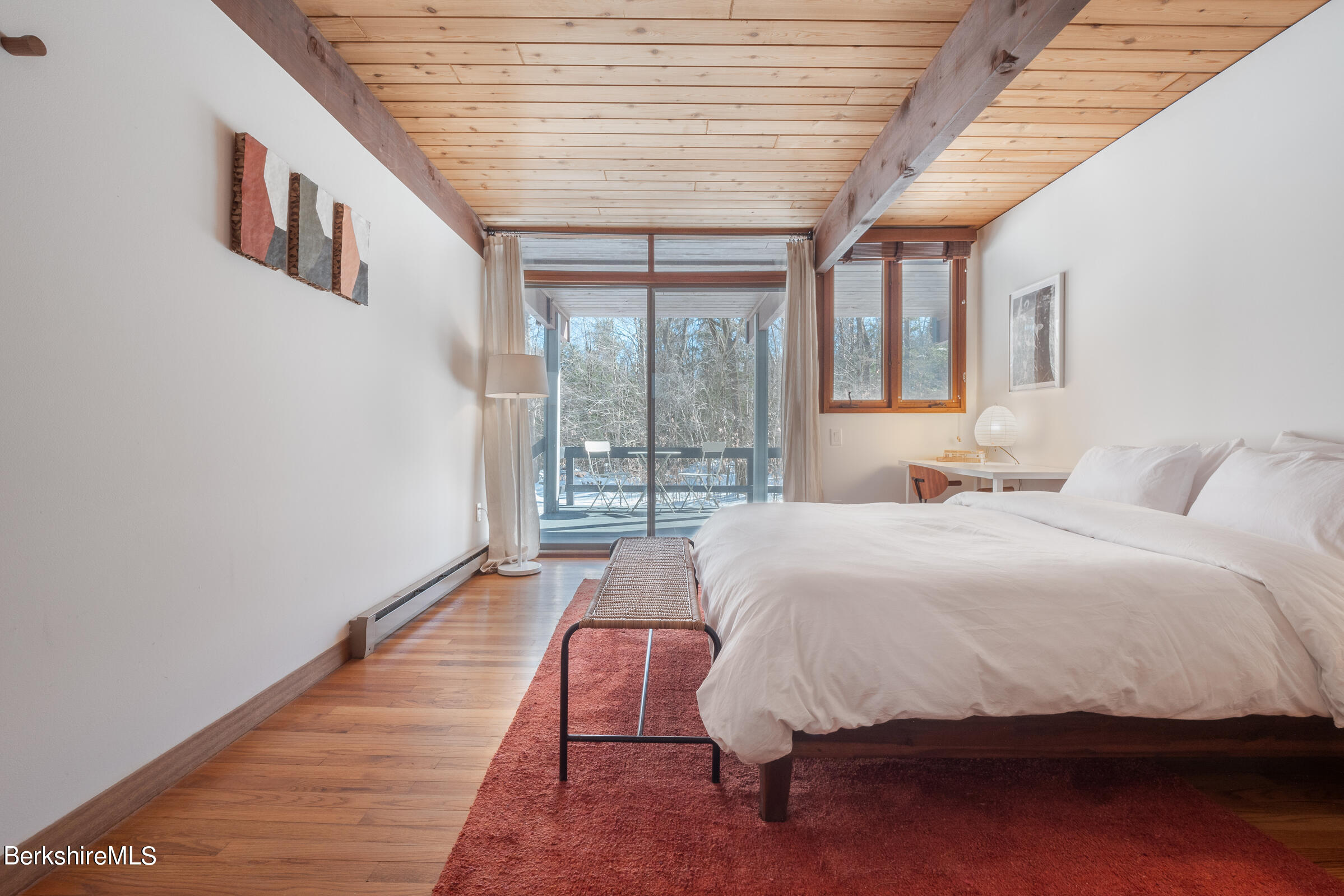176 Beech Tree Lane Becket, MA 01223 - Photo 27 of 44 a bedroom with a bed and a large window