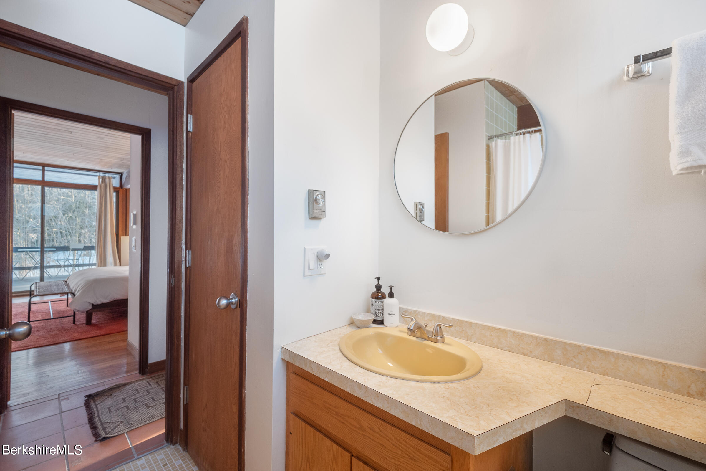 176 Beech Tree Lane Becket, MA 01223 - Photo 28 of 44 a bathroom with a sink and a mirror