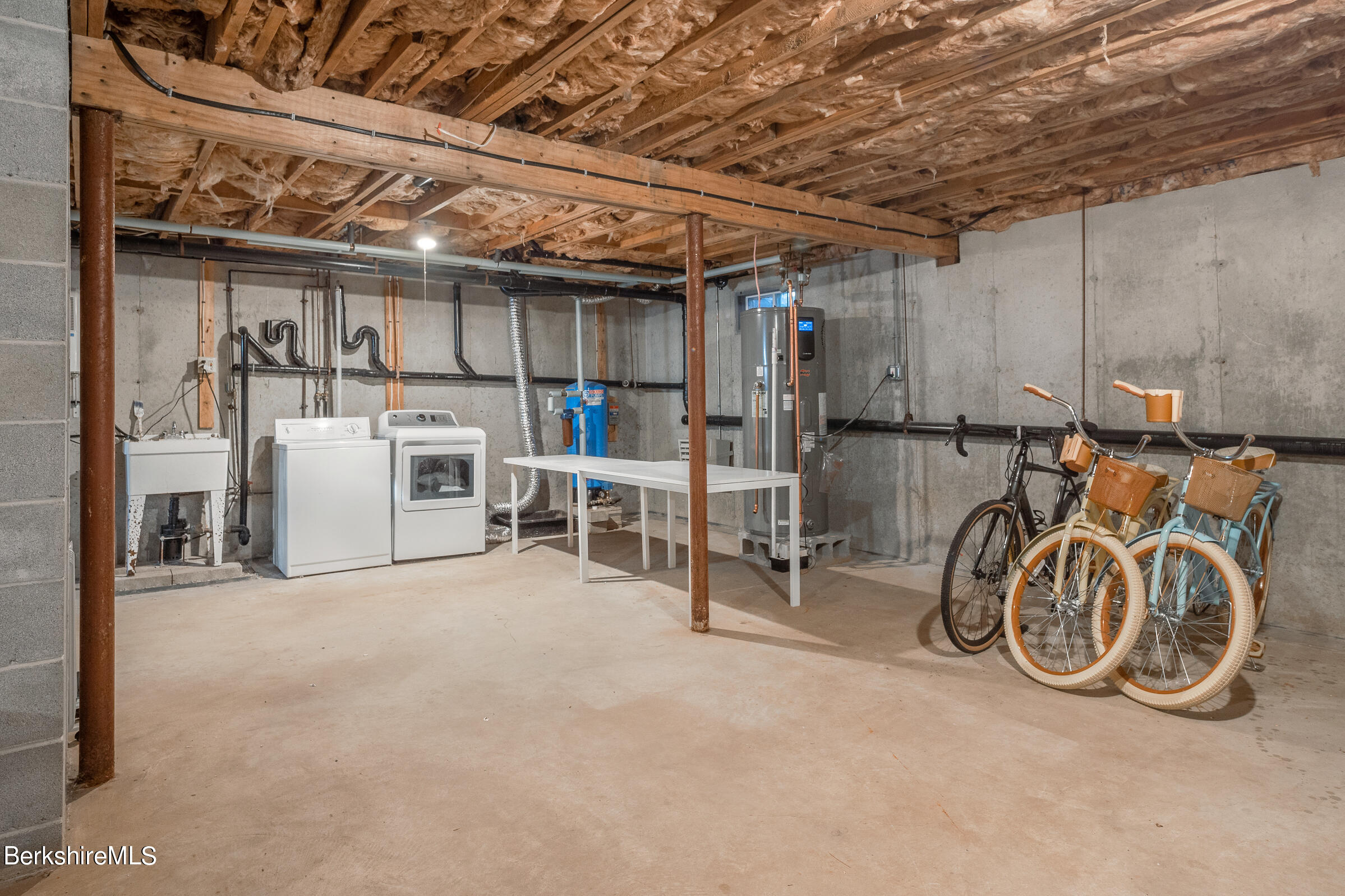 176 Beech Tree Lane Becket, MA 01223 - Photo 31 of 44 a view of a storage room with racks on the wall
