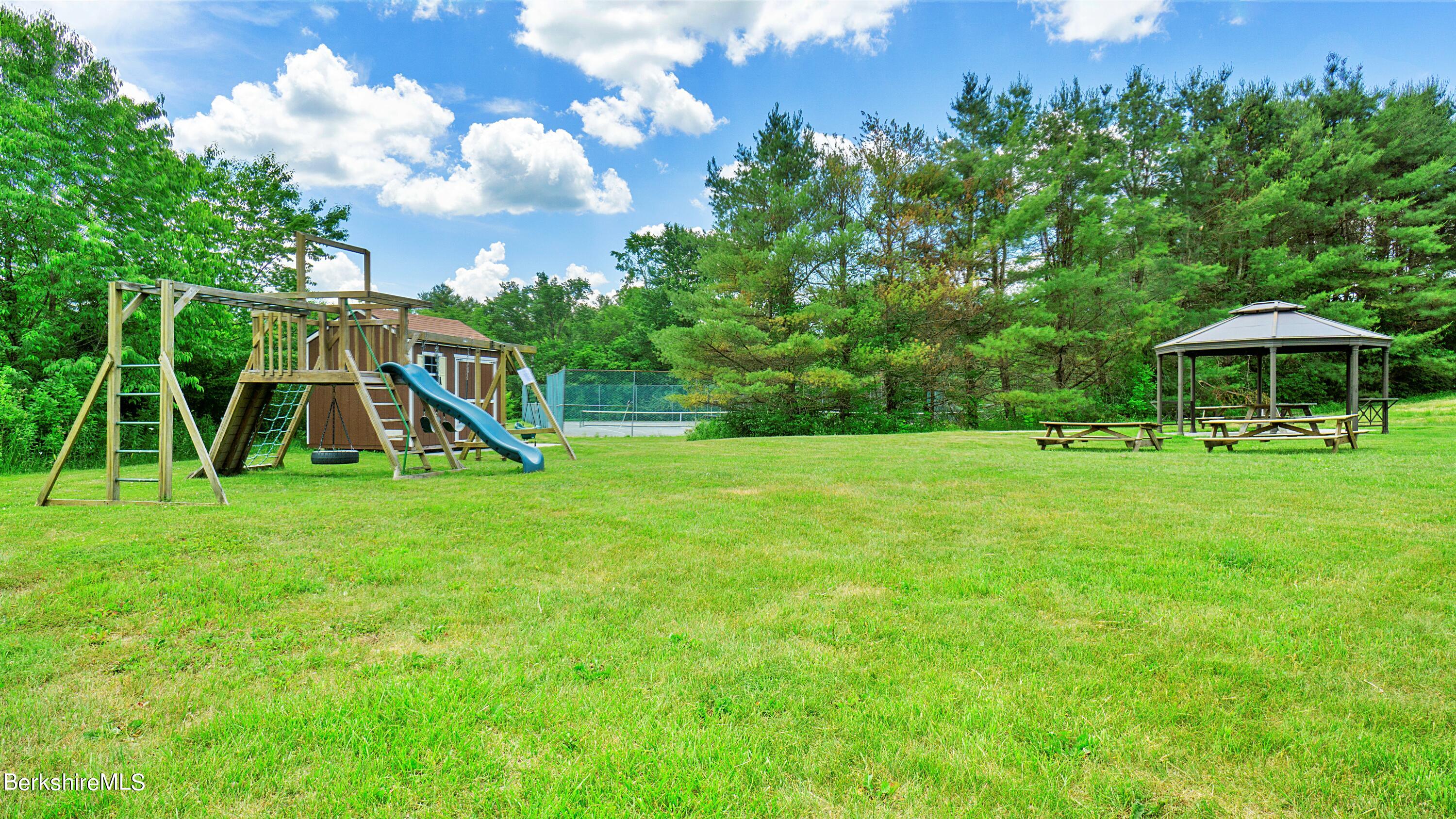 176 Beech Tree Lane Becket, MA 01223 - Photo 37 of 44 a view of a garden with a slide