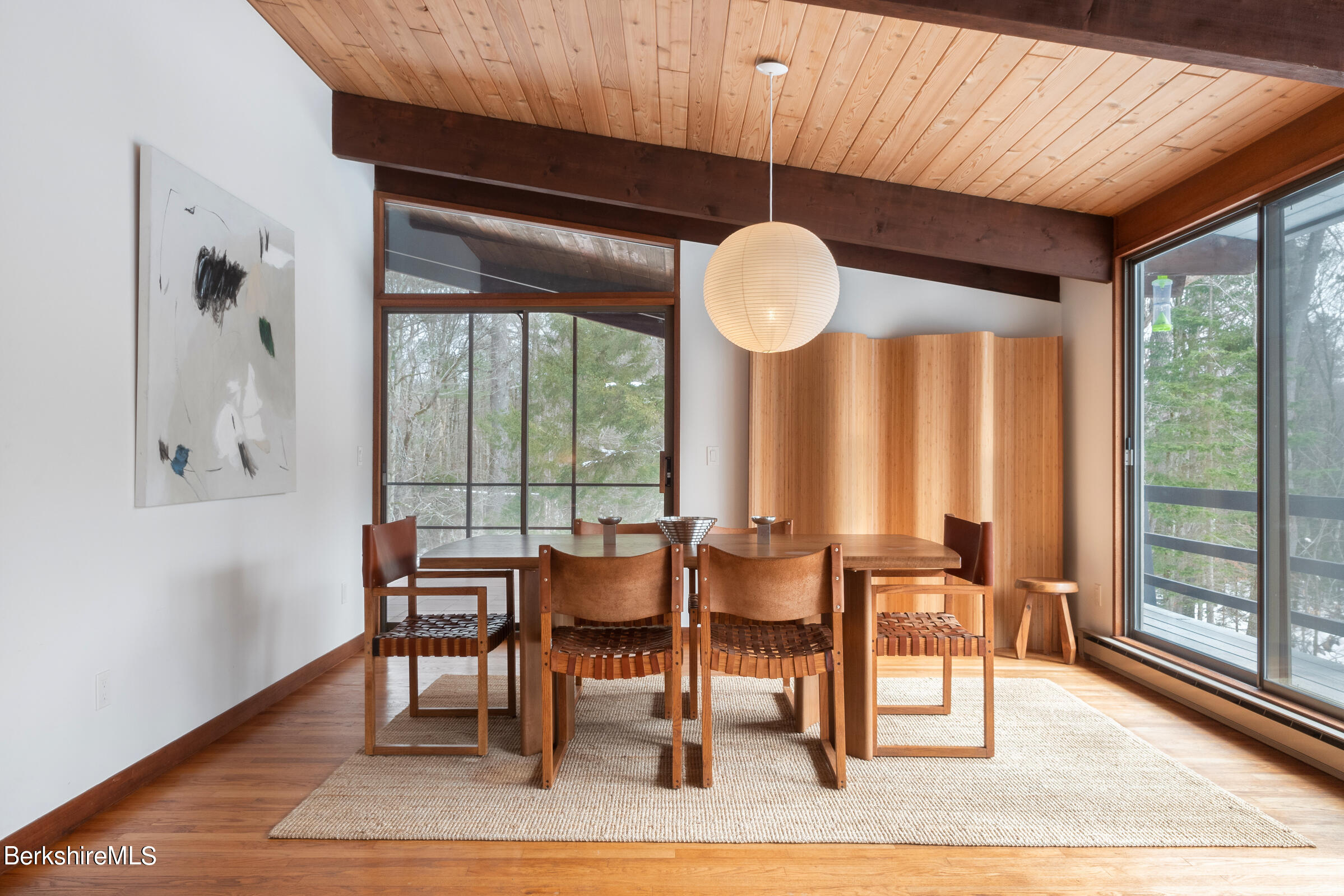 176 Beech Tree Lane Becket, MA 01223 - Photo 9 of 44 a dining room with wooden floor table and chairs
