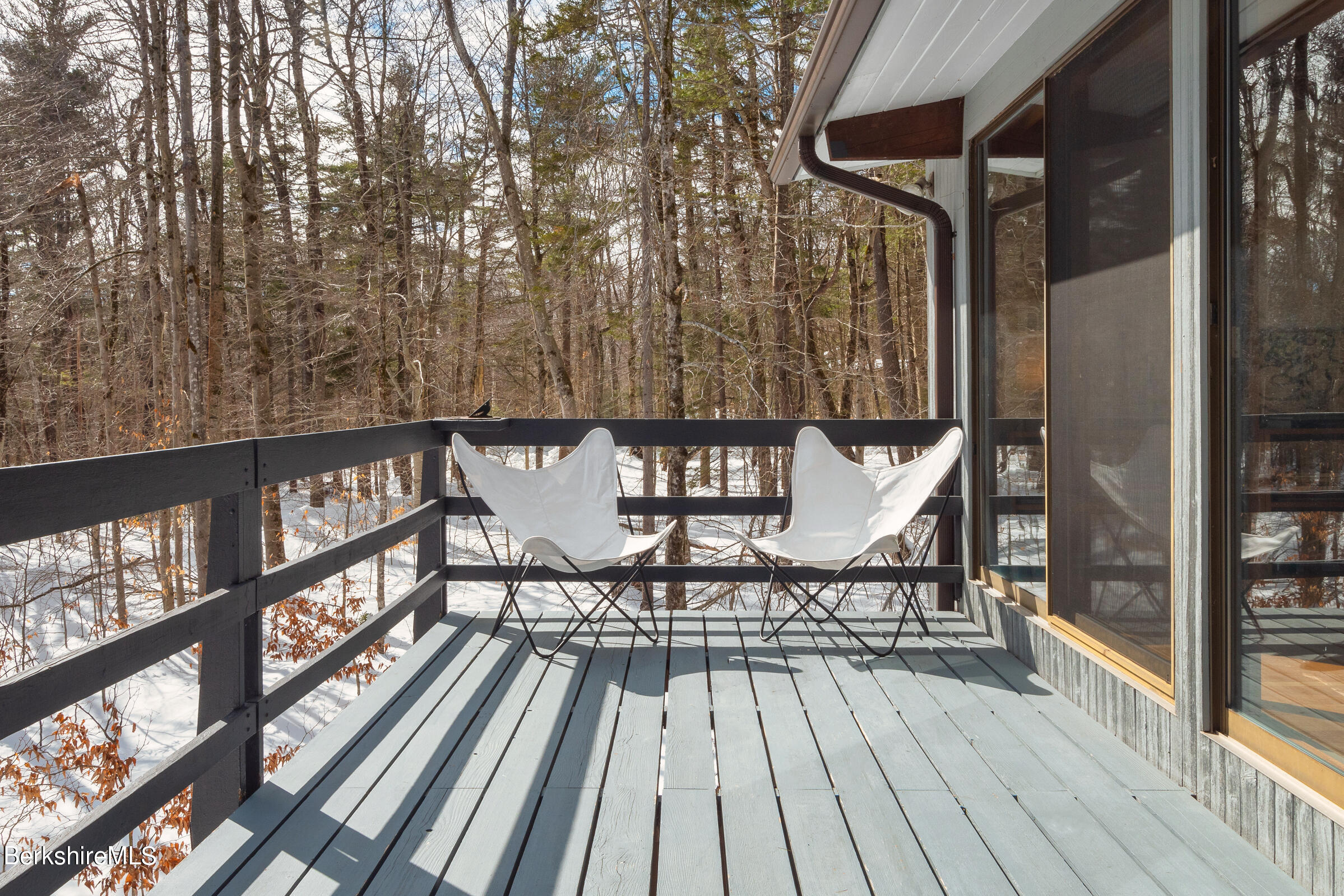 176 Beech Tree Lane Becket, MA 01223 - Photo 10 of 44 a view of a chairs on the deck