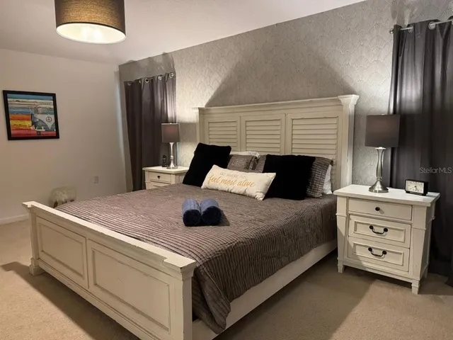 a bedroom with a bed and a fireplace