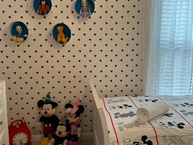 a bedroom with a bed and a cabinets