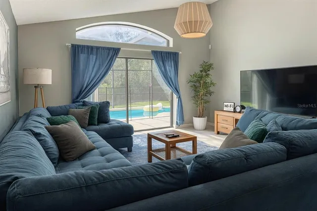 a living room with furniture and a flat screen tv