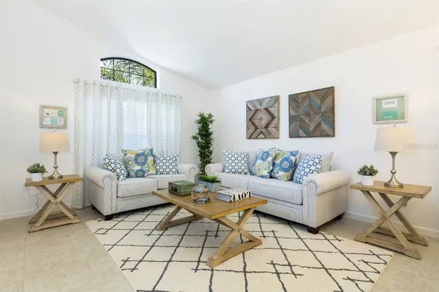 a living room with furniture and white walls