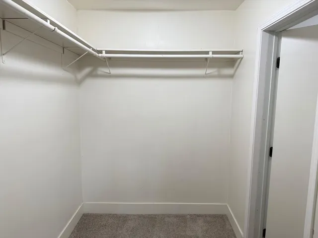 a view of bathroom with a sink toilet and wooden floor