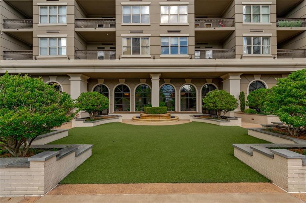 3334 Peachtree Road Northeast, Unit 107 Atlanta, GA 30326 - Photo 1 of 1 a view of a building with garden