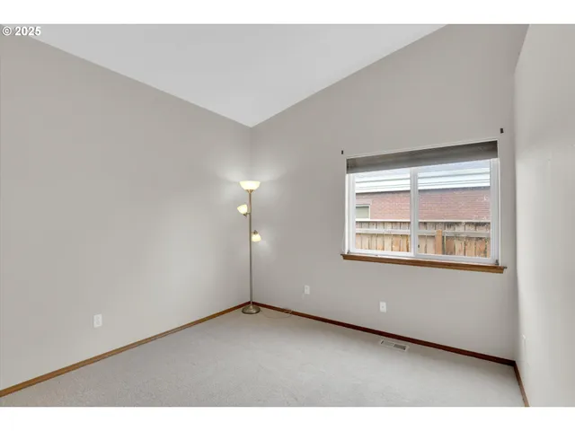 a bathroom with a granite countertop sink a toilet a shower and a mirror