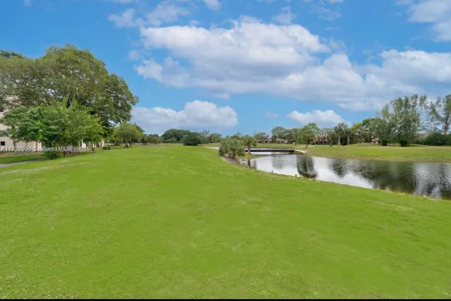 a view of a lake with houses in the back