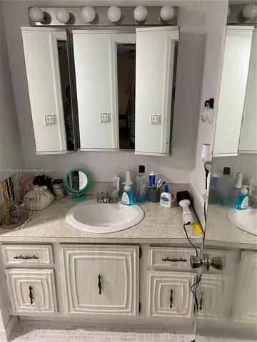a view of a hallway with wooden floor and closet