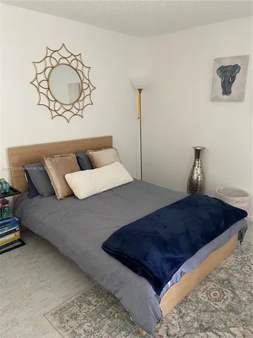 a view of a chair and table in the balcony
